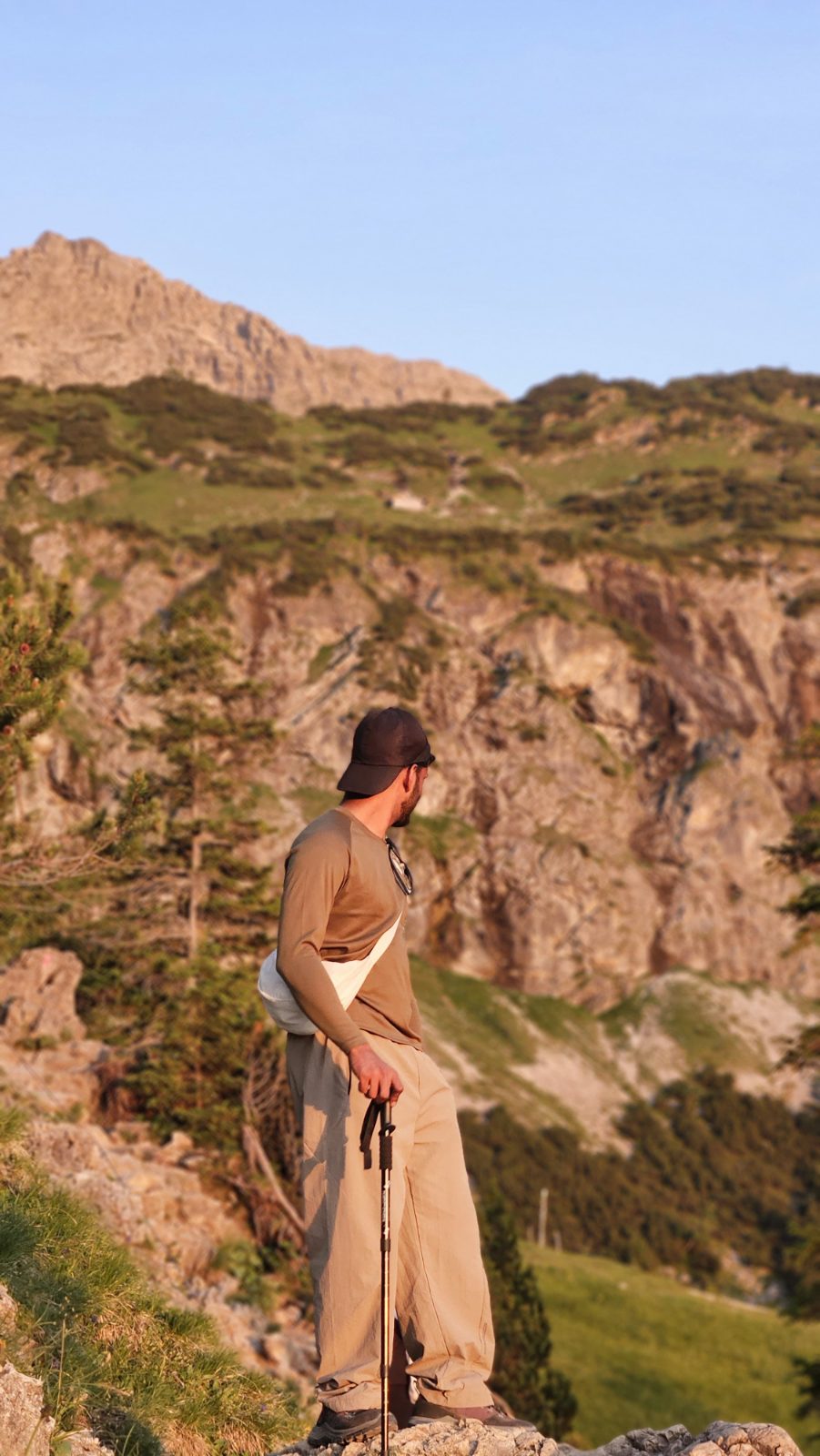 Golden hour over the ridge, hiking pole in hand
